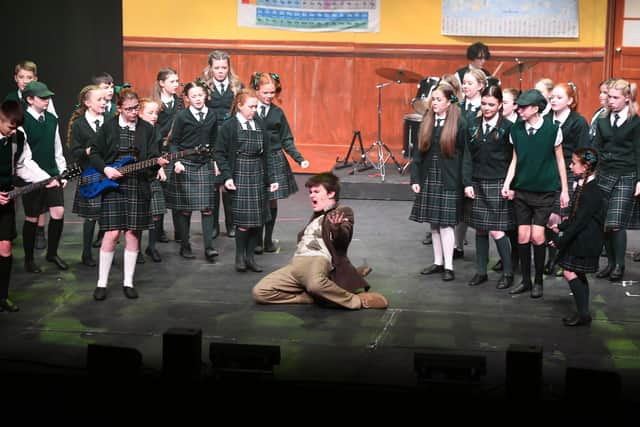 Lochlan Black as Dewey Finn shares his love of rock music with the Horace Green pupils