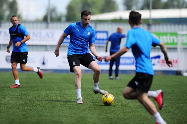 Anton Dowds passes the ball during a training session at the Falkirk Stadium, the forward has still trained with the Bairns whilst on loan