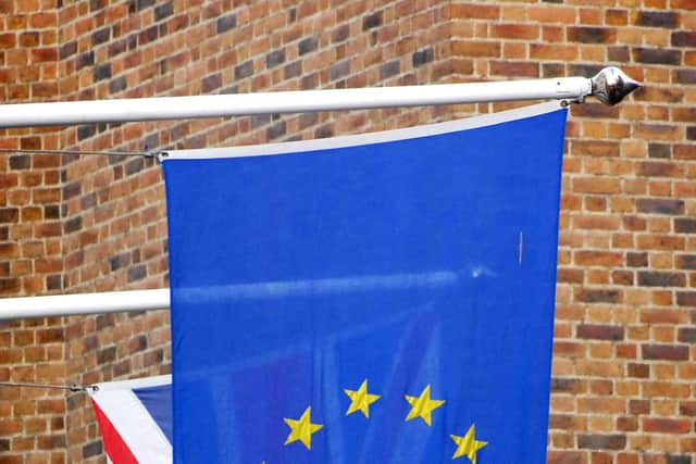The Union Jack pictured behind the European Union flag in London. PRESS ASSOCIATION Photo. Tim Ireland/PA