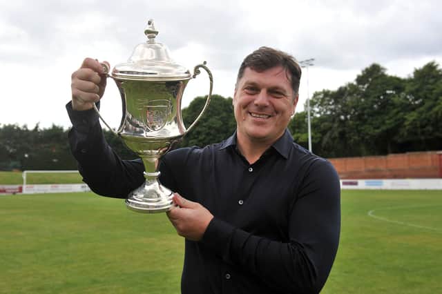 Dunipace Danny Smith manager with the South Challenge Cup trophy. Photo: Michael Gillen