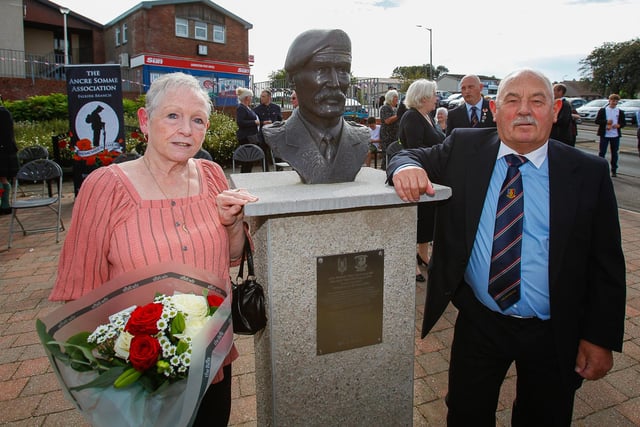 William McAleese and his wife Jane with the memorial bust to William's twin brother John "Mac" McAleese of 22 SAS