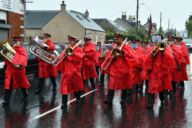 Their uniforms protected from the rain, the members of Linlithgow Reed Band take part in the parade.