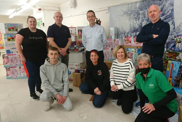 Kersiebank Community Project Christmas appeal – front row, Reece Temporal, deliveries KCP; Donna Murray, fundraiser; KCP; Nicola Kirkham, administrator, INEOS;  Bindi Green, chair of Kersiebank Community Project;  back row – Cheryl McDermid, fundraiser; Gary Duncan, operations INEOS; Bill Sloane, asset manager, INEOS,Cliff Bowen, Unite the Union convener on site INEOS FPS.