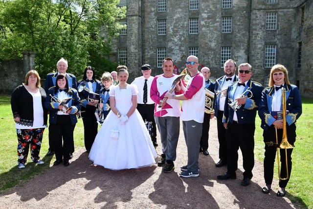 A day to remember for Unison Kinneil Band, Fair Queen Ellie Van Der Hoek,  David Allan and Stuart Johnston, Microplus with baton.