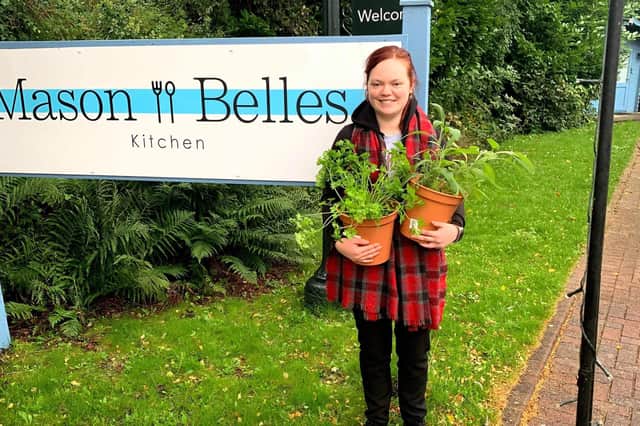 Young chef Lara Aitken with coriander and sage that she started growing at home to use in the restaurant
