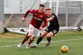 Adam Corbett battles for possession with Rovers' Josh Jack (Pictures: Scott Louden)
