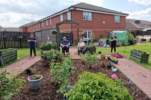 Langlees Primary School pupils have helped to revive a barren area of shrubbery at Newcarron Court Care Home. Contributed.
