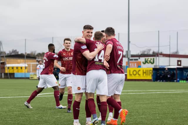 Gavin Reilly is mobbed by his Stenhousemuir team-mates after netting the opener (Photo: Raymond Davies)