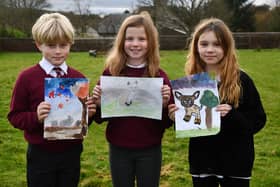 Drumbowie Primary School P5 pupils Brodie Young, Orlagh Lindsay and Rhianne Craig display their winning nature designs