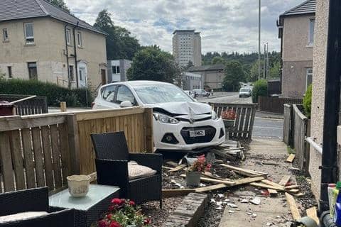 The car ploughed through the garden fence at the property before hitting the wall of the house (Picture: Submitted)