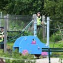 Police continue their investigations in Coneypark Crescent near a playpark and allotments close to Glenskirlie Castle. Pic: Michael Gillen