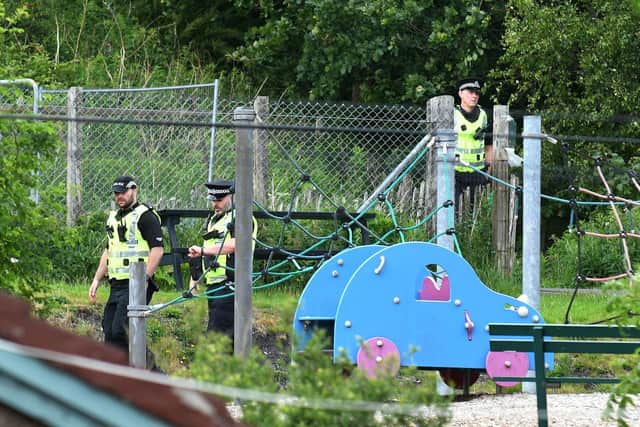 Police continue their investigations in Coneypark Crescent near a playpark and allotments close to Glenskirlie Castle. Pic: Michael Gillen