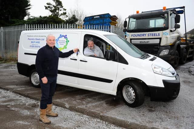 Kersiebank Community Project volunteer Cameron Green receives the project's new vehicle to help them distribute food to the community from Foundry Steel's manager Alex Dillon