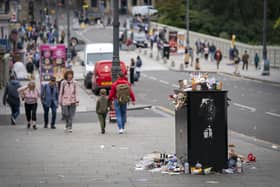 Bins and litter along Waverley Bridge in Edinburgh city centre as cleansing workers from the City of Edinburgh Council are on the fourth day of eleven days of strike action. Workers at waste and recycling depots across the city have rejected a formal pay offer of 3.5 percent from councils body Cosla. Picture date: Monday August 22, 2022.