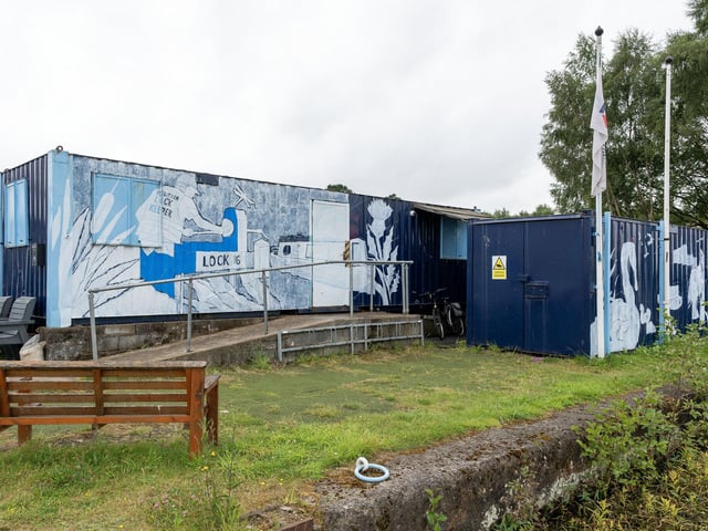 Some of the work on the side of the shipping containers.