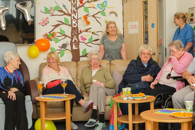 Residents gathered in the colourful lounge at the home which overlooks Dollar Park.