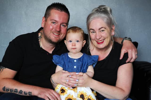 Stephen Shaw and Georgina Leslie with one-year-old daughter Aleena.  Pic: Michael Gillen.