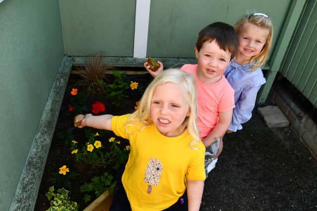 Youngsters attending Polmont Playgroup with new planter in the grounds of Greenpark Community Centre