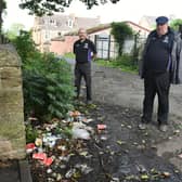 The lane between Pepe's Piri Piri and  St Johns Church just off Glasgow Road, Camelon, has long been a dumping ground for litter and other items and now John Hosie and Dan Rous of community group Our Place Camelon and Tamfourhill are looking for help to deal with the problem