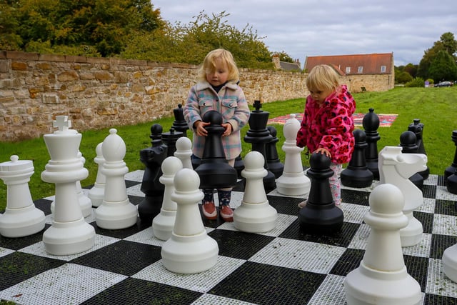 Youngsters enjoying the chess board at Kinneil House.