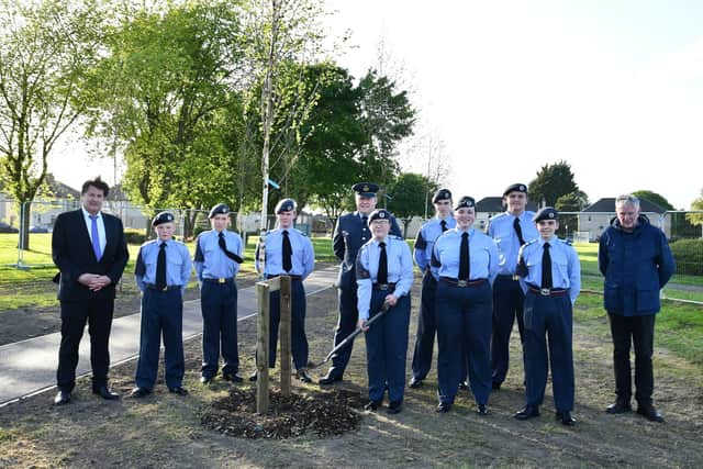 ATC 470 Squadron plant eight silver birch tree as part of the Queen's Green Canopy. Topping out, Sgt Isla Mayor watched on by Provost Robert Bissett (left). Pic: Michael Gillen