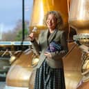 Festival director Alison Strauss marks 15 years of HippFest with a celebratory nip of Rosebank Lowland Single Malt. Pic: Scott Louden