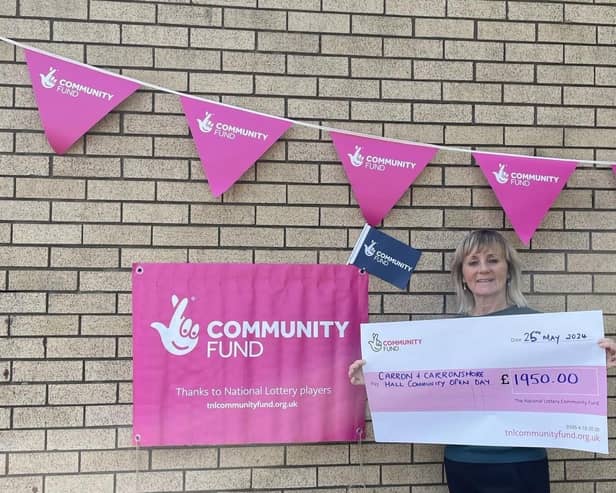 Angie Bailey with the cheque from the National Lottery's Community Fund towards the Open Day. Pic: Contributed