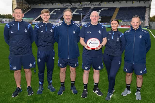 Award winner John McGlynn with his Falkirk backroom staff