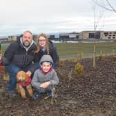 One of the families who turned up to help with planting in the park.