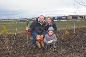 One of the families who turned up to help with planting in the park.
