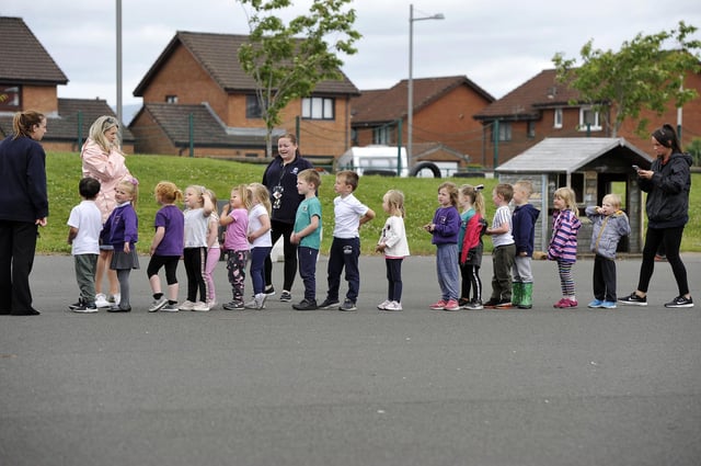 St Bernadette's Primary School youngsters were treated to ice cream at Father John McInnes Silver Jubilee celebration. Picture: Michael Gillen.