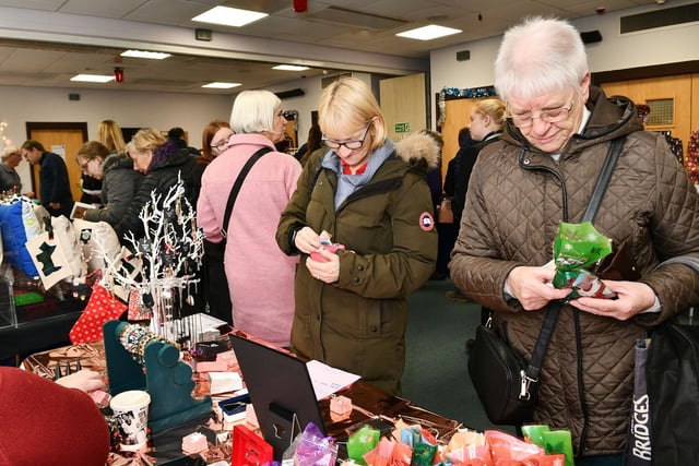 Shoppers survey all the lovely Christmas gift ideas on offer.