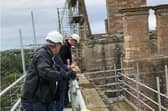 Scaffolding will remain on north range, where much work is to be done.
