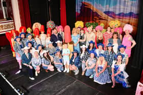 The full cast of Priscilla Queen of the Desert on the Dobbie Hall stage.
