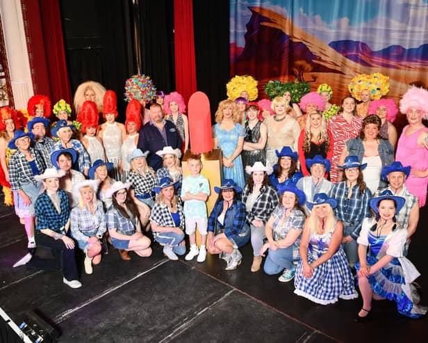 The full cast of Priscilla Queen of the Desert on the Dobbie Hall stage.