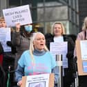 Mesh implant patients stage a protest to challenge government over surgery delays.