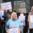 Mesh implant patients stage a protest to challenge government over surgery delays.