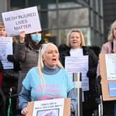 Mesh implant patients stage a protest to challenge government over surgery delays.