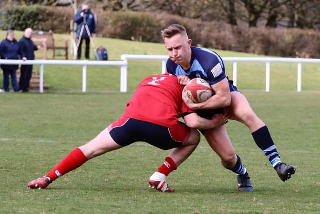 Cameron McKenna is brought down as he looked to go past his man (Picture: Gordon Honeyman)