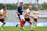Falkirk ace Gary Oliver up against Liam Boyce (Photo: Michael Gillen)