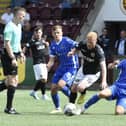 Stenhousemuir winger Euan O'Reilly is hassled by St Johnstone's Max Kucheriavyi and Cameron Ballantyne  Photo: Alan Murray)