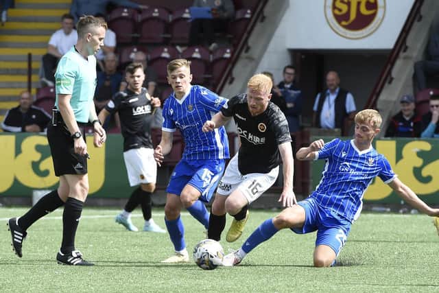 Stenhousemuir winger Euan O'Reilly is hassled by St Johnstone's Max Kucheriavyi and Cameron Ballantyne Photo: Alan Murray)