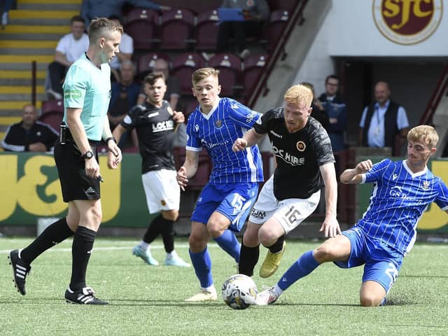 Stenhousemuir winger Euan O'Reilly is hassled by St Johnstone's Max Kucheriavyi and Cameron Ballantyne  Photo: Alan Murray)