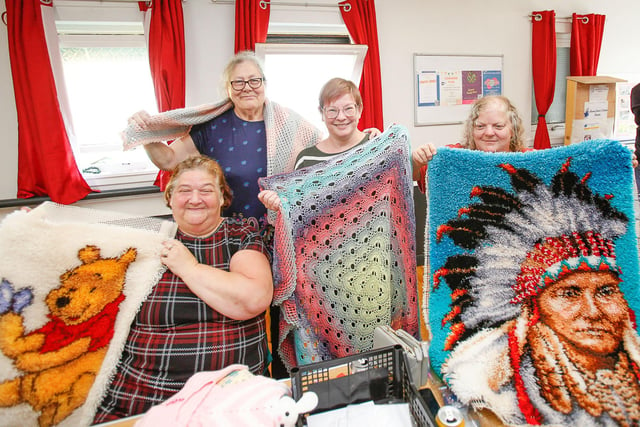 Members of the Share a craft group with some of their work
