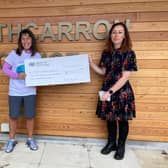 Maddiston woman Aurel Lewis presented Strathcarron Hospice with a cheque for more than £4200. Contributed.