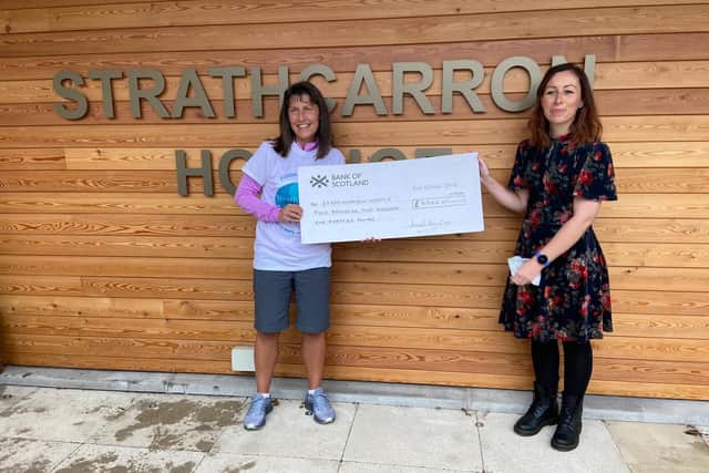 Maddiston woman Aurel Lewis presented Strathcarron Hospice with a cheque for more than £4200. Contributed.