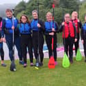 Members of Forth Valley Sensory Centre's Talk and Sign group take to the water for some paddle boarding