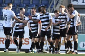 Mark Docherty, wearing the captain's armband. celebrates with his East Stirlingshire's team-mates (Photo: Alan Murray)