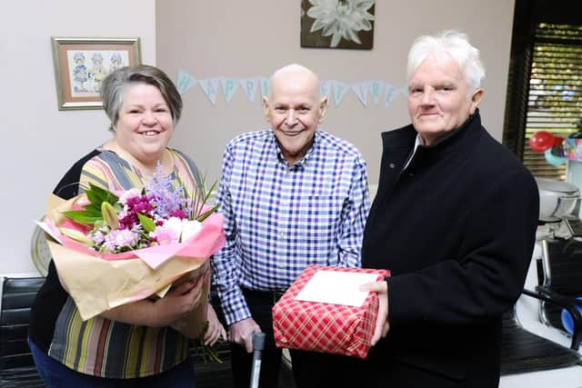 David Burns retires after 57 years working at Pretam Beau.  He's pictured with daughter Nicole who has worked alongside him for 31 years and Councillor Billy Buchanan, who presented him with a gift on behalf of the local community.  Pic: Alan Murray.