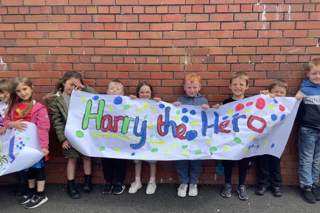 Carmuirs Early Learning and primary pupils turn out to congratulate Harry Frank on completing his cancer treatment. Pic: Contributed
